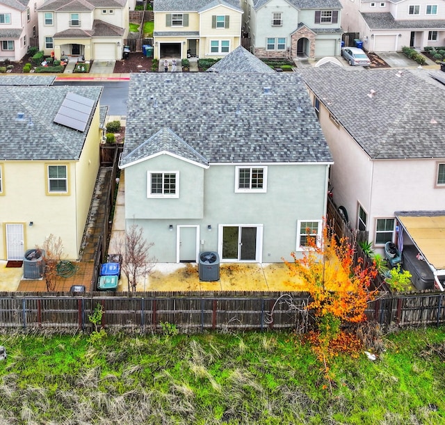 back of property featuring cooling unit