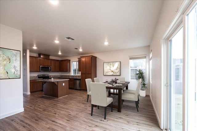 dining area with hardwood / wood-style floors