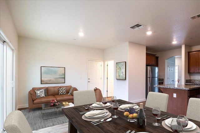 dining room with light wood-type flooring