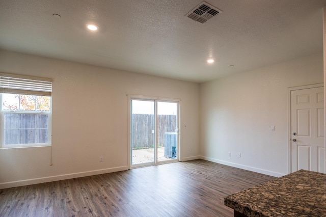 unfurnished room featuring dark hardwood / wood-style flooring