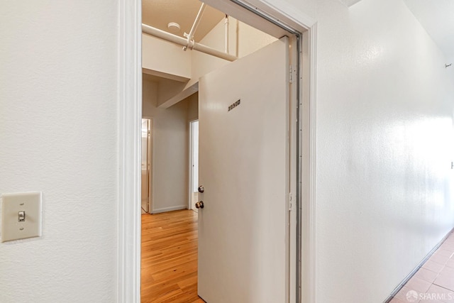 hallway with light wood finished floors