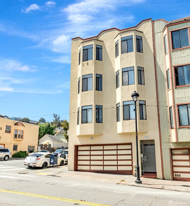 view of building exterior featuring a garage