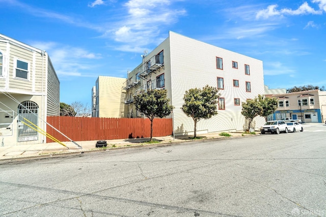 view of building exterior featuring fence