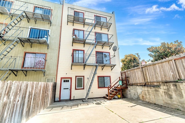 view of building exterior with fence