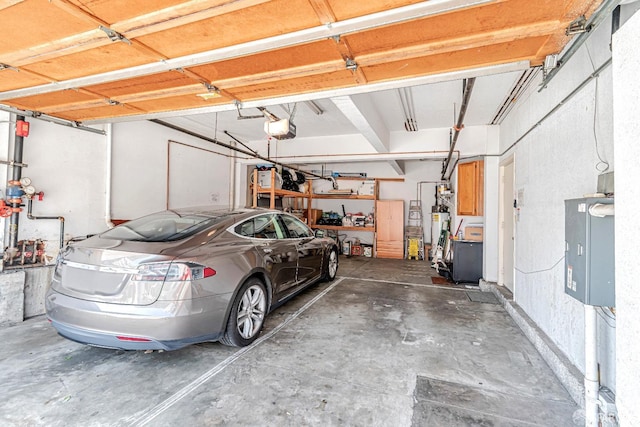 garage with a garage door opener and water heater
