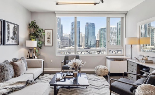 501 Beale St Unit 18E, San Francisco, CA 94105 - living area featuring wood finished floors, a view of skyline, and baseboards