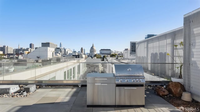 view of patio / terrace with a view of city and grilling area