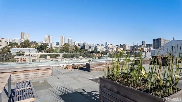 view of patio / terrace featuring a city view