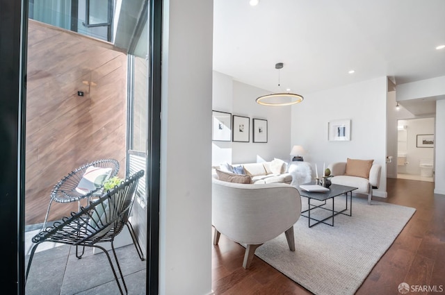 living area featuring wood finished floors and recessed lighting