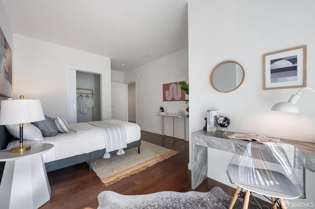 bedroom featuring wood finished floors