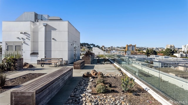 exterior space with a city view and a patio