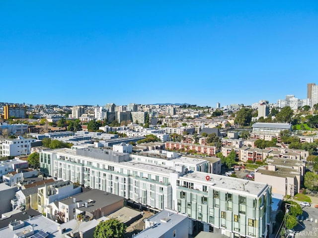 birds eye view of property featuring a city view