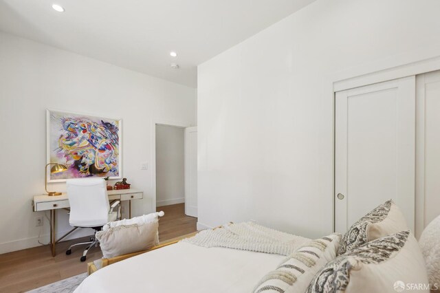 2237 Bryant St Lower, Lower, San Francisco, CA 94110 - bedroom featuring light wood-style flooring, a closet, baseboards, and recessed lighting