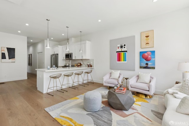 2237 Bryant St Lower, Lower, San Francisco, CA 94110 - living room featuring light wood-type flooring, recessed lighting, and baseboards