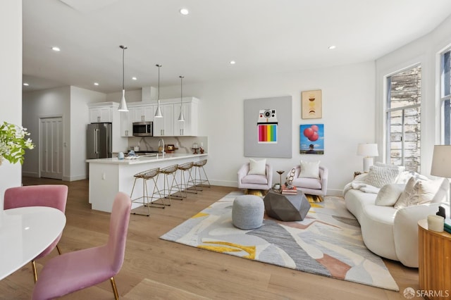 2237 Bryant St Lower, Lower, San Francisco, CA 94110 - living room with recessed lighting, baseboards, and light wood finished floors