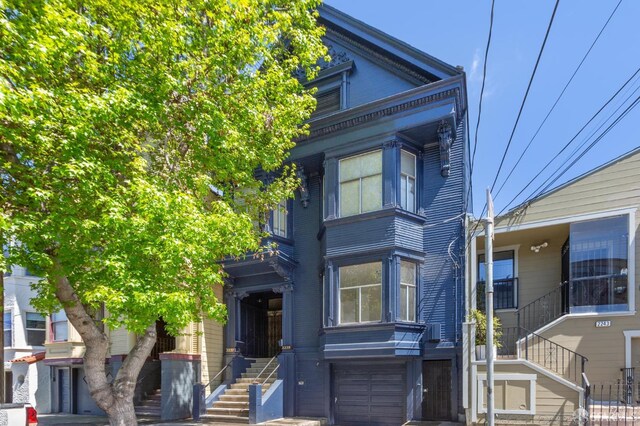 2237 Bryant St Lower, Lower, San Francisco, CA 94110 - view of front of property with stairway and an attached garage
