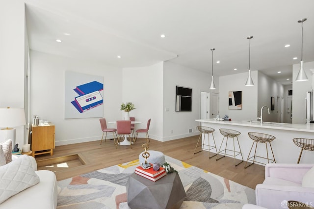 2237 Bryant St Lower, Lower, San Francisco, CA 94110 - living room featuring light wood-style floors, recessed lighting, and baseboards