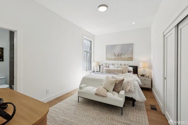 2237 Bryant St Lower, Lower, San Francisco, CA 94110 - bedroom with wood finished floors, baseboards, recessed lighting, and a closet