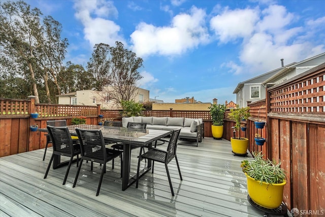 deck with outdoor dining area and an outdoor living space