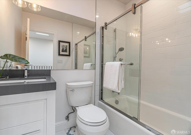 bathroom featuring combined bath / shower with glass door, vanity, and toilet