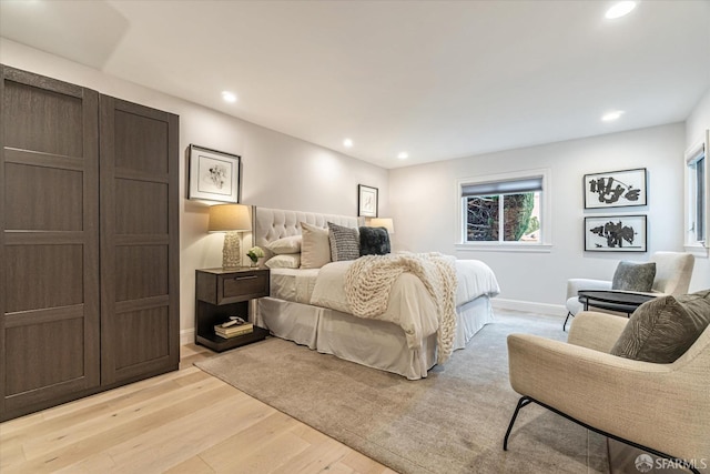 bedroom featuring recessed lighting, baseboards, and light wood finished floors