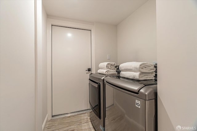 laundry area featuring laundry area and washing machine and dryer