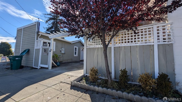 view of side of home with a patio