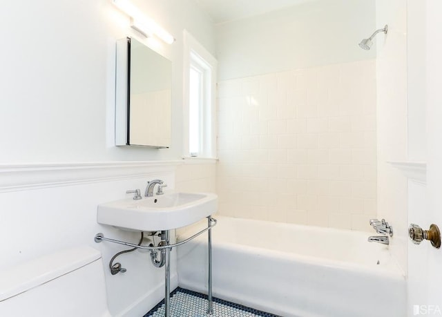bathroom with toilet and  shower combination