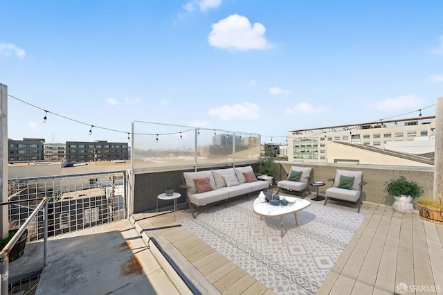 view of patio with an outdoor hangout area and a balcony