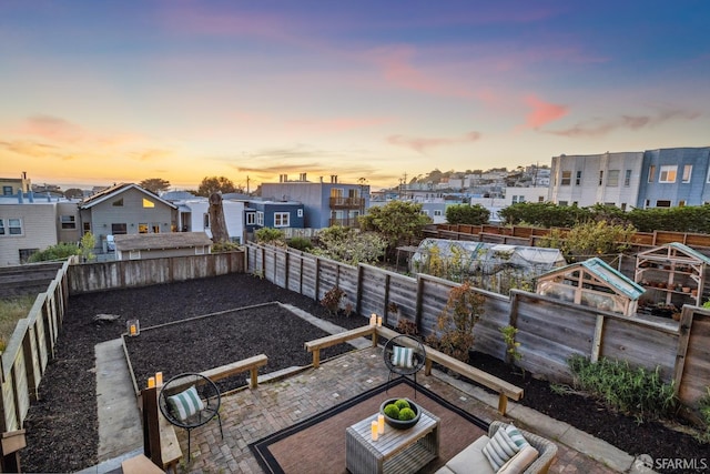 831 45th Ave, San Francisco, CA 94121 - yard at dusk featuring a residential view, a patio area, and a fenced backyard