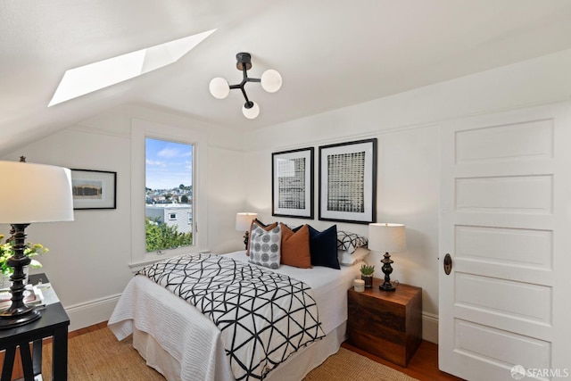 462 Clipper St, San Francisco, CA 94114 - bedroom with a skylight, wood finished floors, baseboards, and lofted ceiling