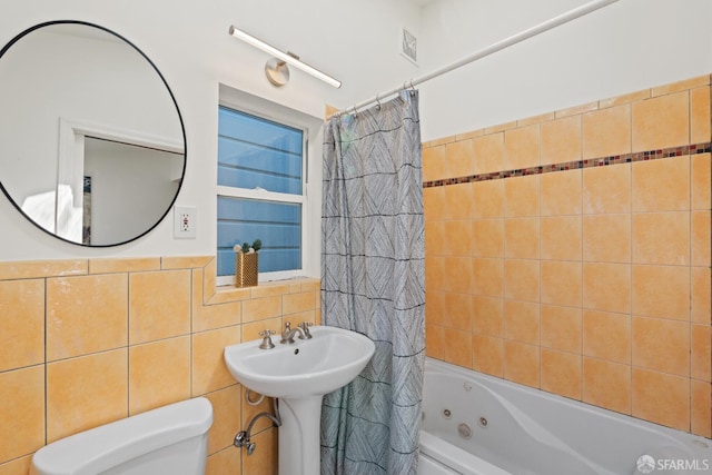 462 Clipper St, San Francisco, CA 94114 - bathroom featuring tile walls, toilet, and a combined bath / shower with jetted tub