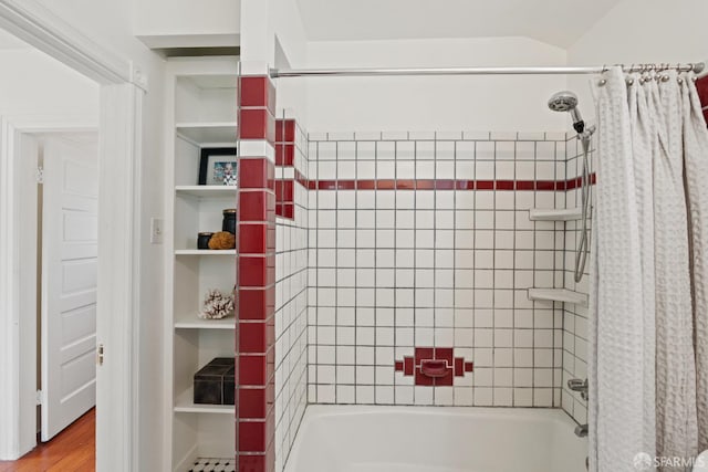 462 Clipper St, San Francisco, CA 94114 - bathroom with shower / bath combo with shower curtain and wood finished floors