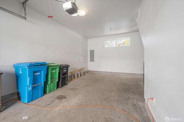 garage featuring electric panel and a garage door opener