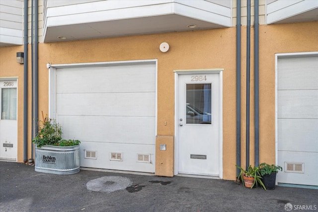 entrance to property featuring a garage