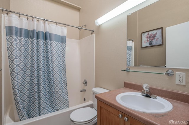 full bathroom featuring shower / bath combo, vanity, and toilet