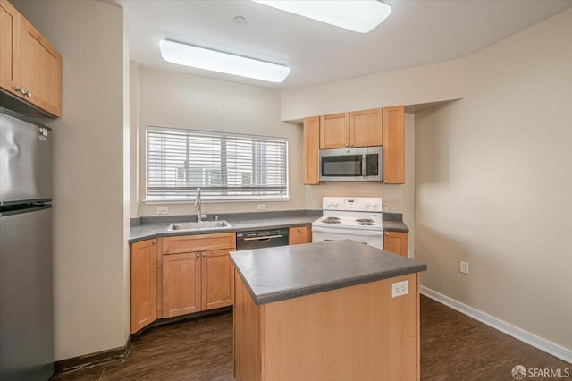 kitchen with sink, dark hardwood / wood-style floors, light brown cabinetry, a kitchen island, and stainless steel appliances