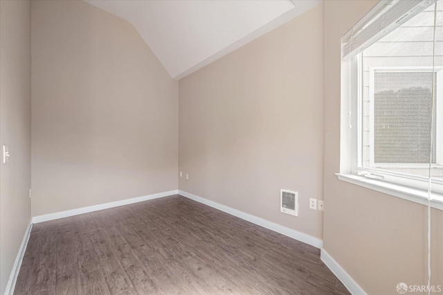 bonus room featuring dark hardwood / wood-style flooring and vaulted ceiling