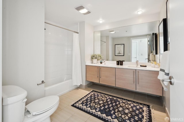 full bathroom featuring vanity, tile patterned flooring, toilet, and shower / bath combo with shower curtain