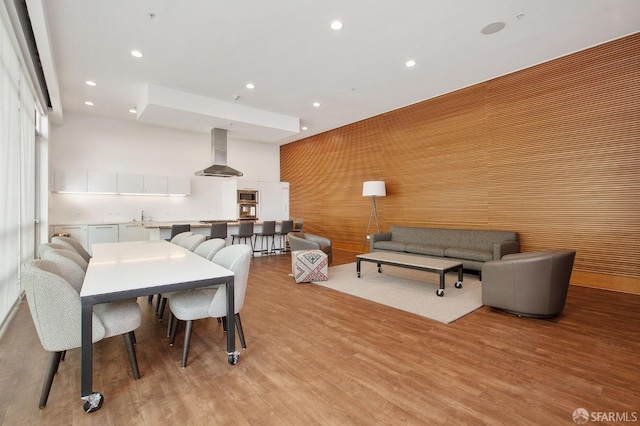 dining space with sink and light hardwood / wood-style flooring