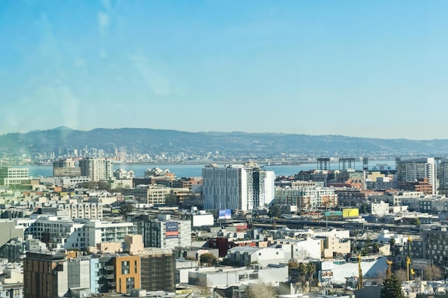 city view featuring a water and mountain view