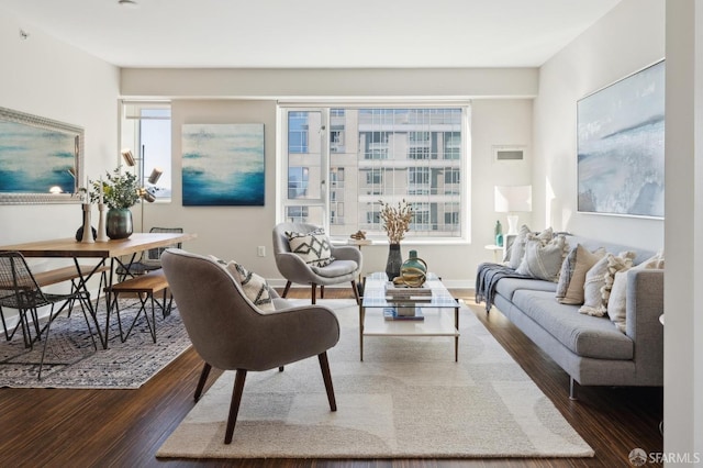 living room featuring dark hardwood / wood-style flooring