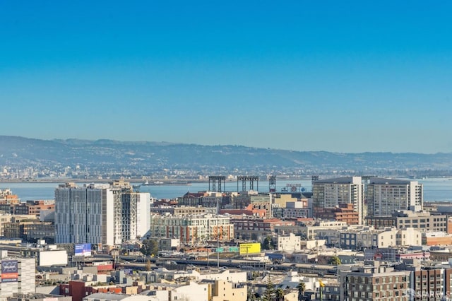 view of city featuring a water and mountain view