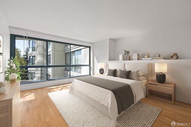 bedroom featuring wood finished floors