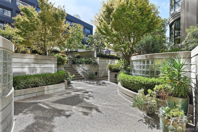 view of patio / terrace with stairway and fence