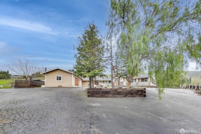 view of front of house with aphalt driveway