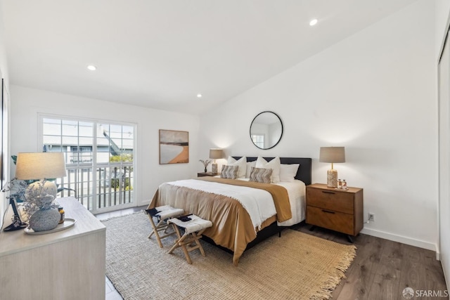 bedroom featuring recessed lighting, wood finished floors, and vaulted ceiling