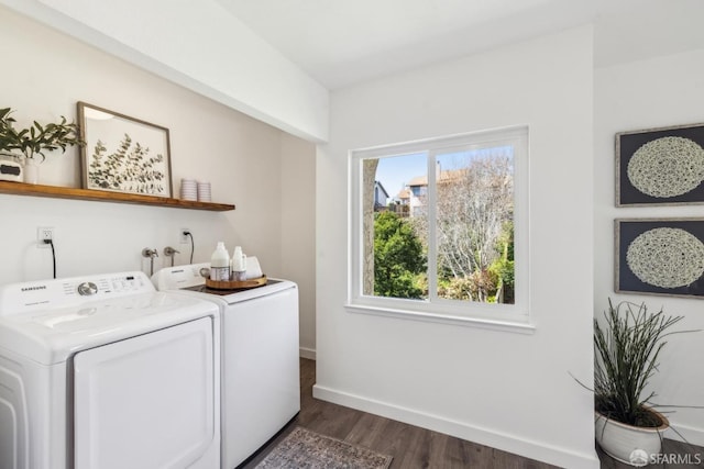 laundry area with baseboards, dark wood-type flooring, independent washer and dryer, and laundry area