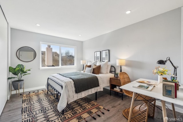 bedroom featuring recessed lighting, baseboards, and wood finished floors