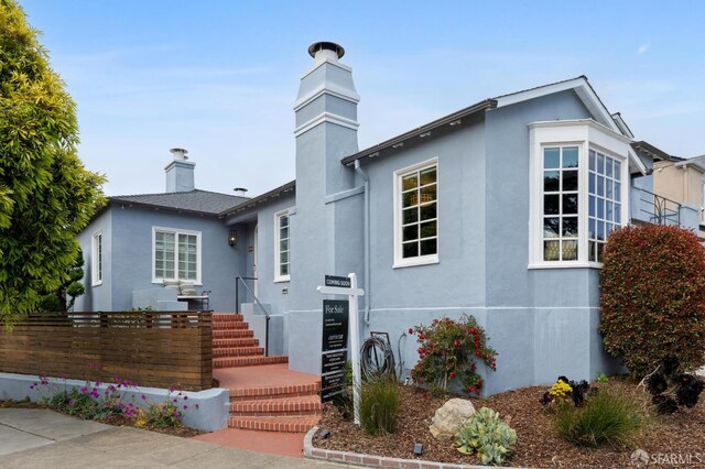 20 Rossmoor Dr, San Francisco, CA 94132 - view of front of home with a chimney and stucco siding